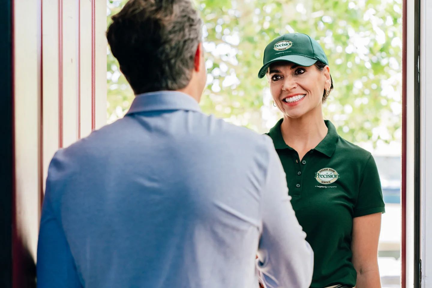 Customer greeting a representative from Precision Garage Door Customer greeting a representative from Precision Garage Door